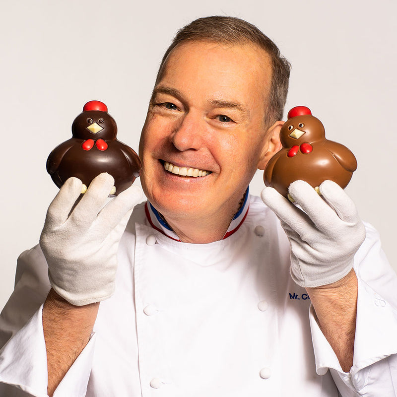 Chef Jacques Torres holding Easter Happy chicks in milk and dark chocolate