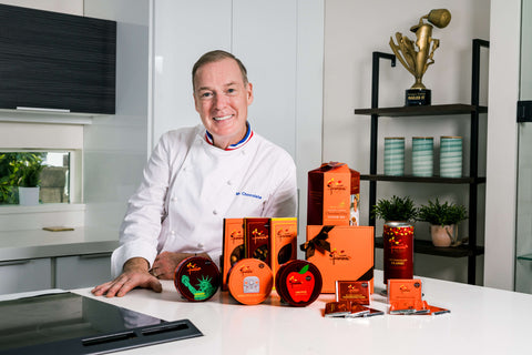 Chef Jacques Torres in Kitchen with Various Products and Nailed It! Trophy