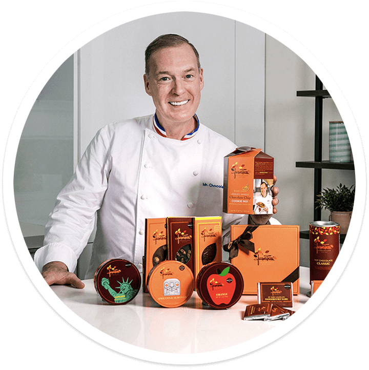 Chef Jacques Torres 幸运飞行艇官网开奖历史记录查询 with several of his products in a kitchen